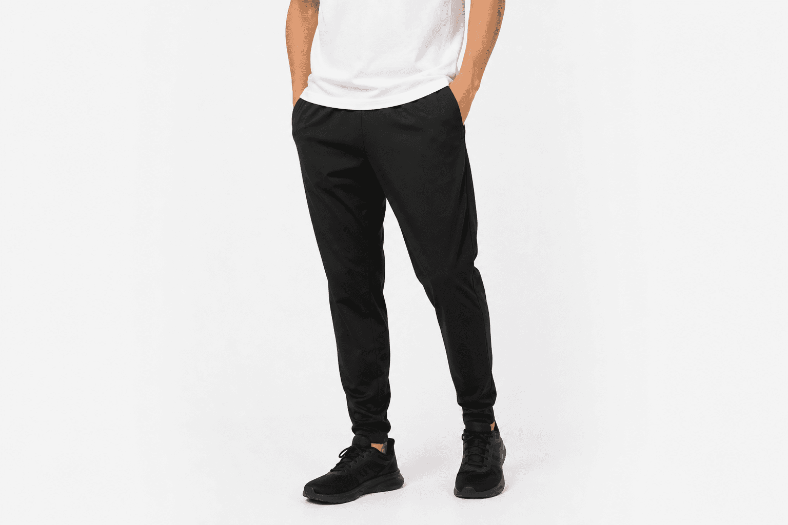 Black track pants — front view
